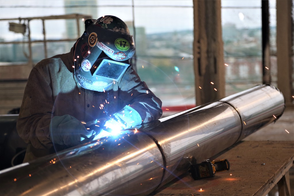 welder welding a pipe