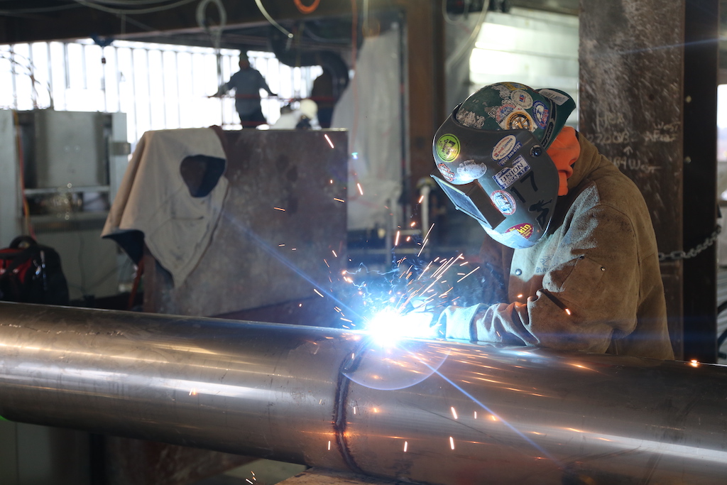 welder welding a tube