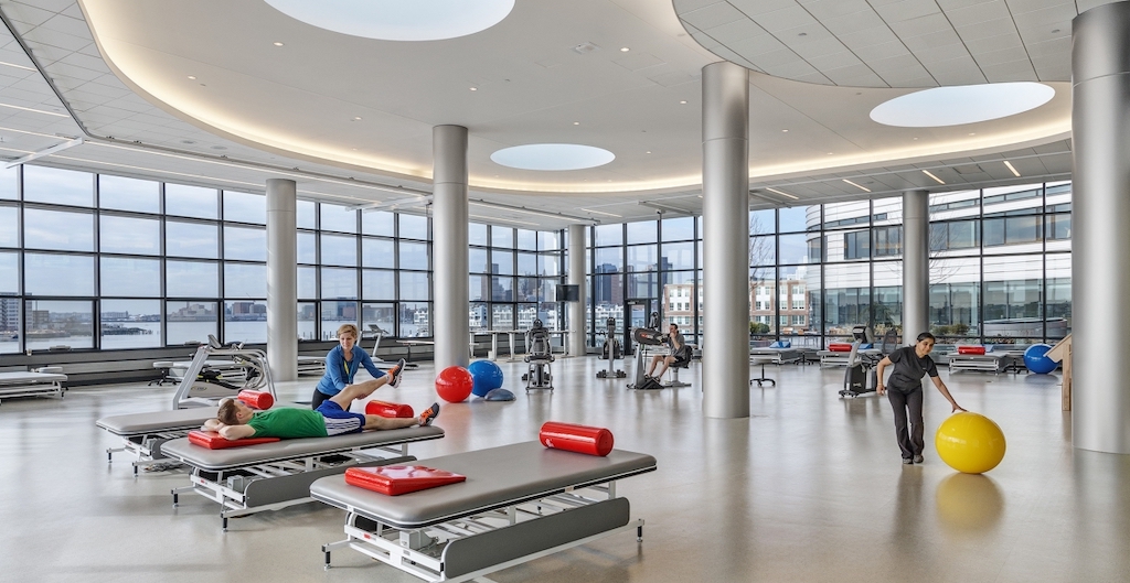 workout room with tables and machines